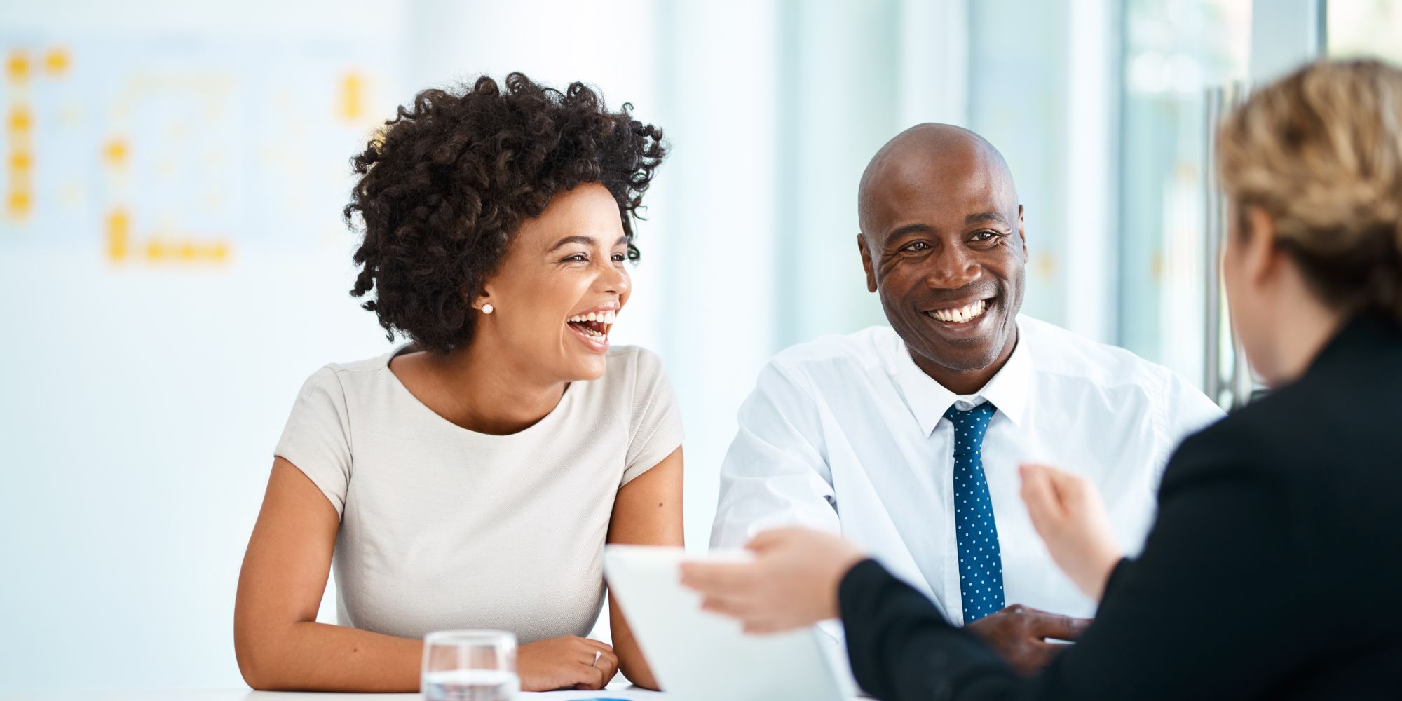 bride and groom in formal attire meeting with specialist