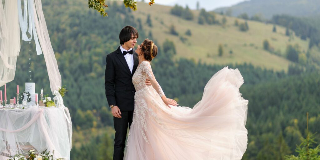 Bride and groom in wedding attire close together